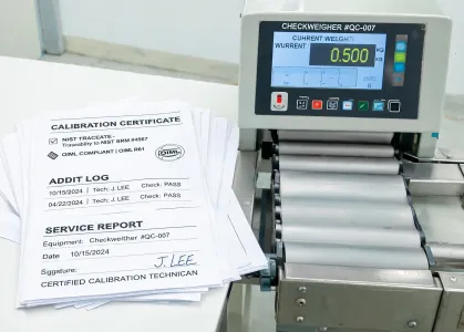 Calibration certificate packet beside weighing station